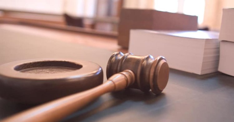 Gavel and legal documents represent a lawsuit filed against Fairhope Planning and Zoning over development decisions