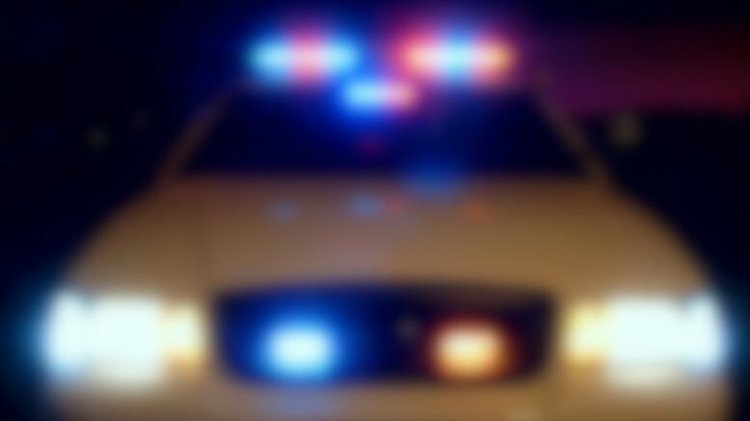 Blurred police car lights suggest investigation into State Representative Randy Davis’ bribery indictment