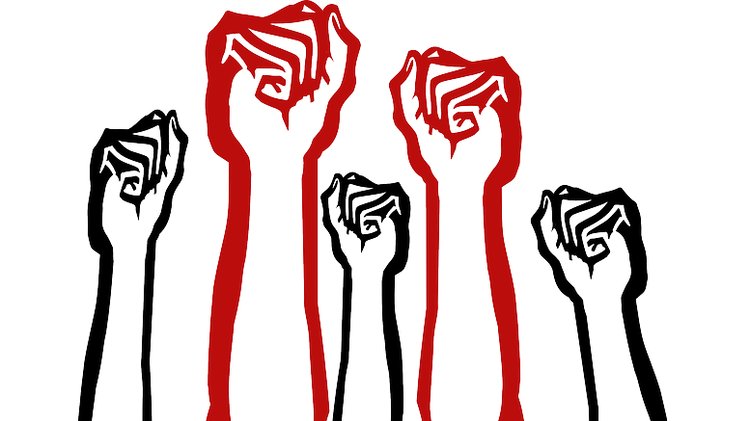 Citizens raising fists in solidarity against local government overreach in Baldwin County