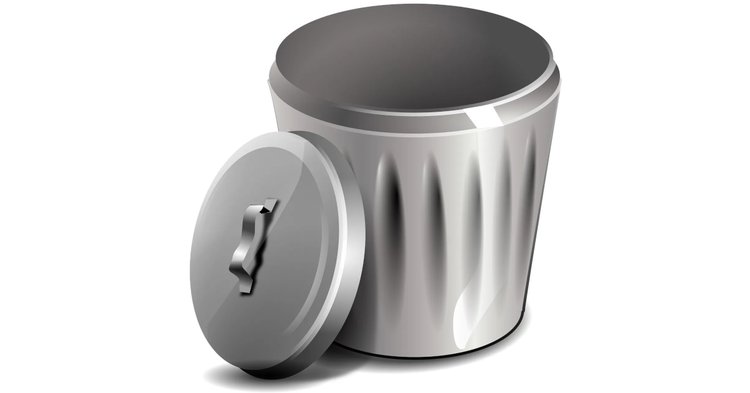 A glossy, metallic trash can with vertical grooves and a slightly ajar lid featuring a handle