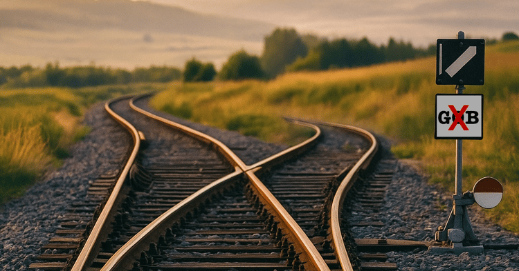 Railway tracks diverging, symbolizing choices in Baldwin County politics; a sign reads “GXB,” referencing the “good ole bo...
