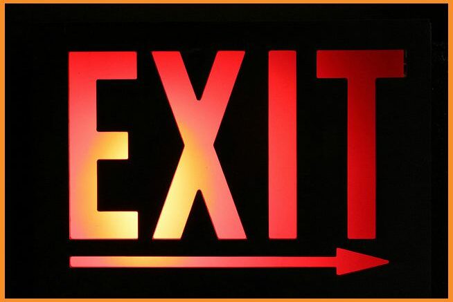 Symbolic exit sign with arrow, representing a turning point for Fairhope as a new mayor takes office after years of leader...