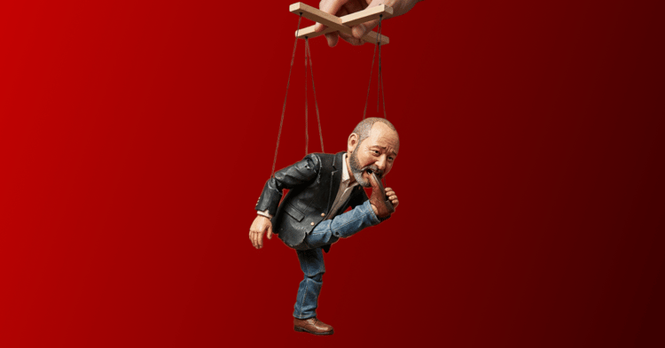 A Chris Elliott puppet biting his foot.