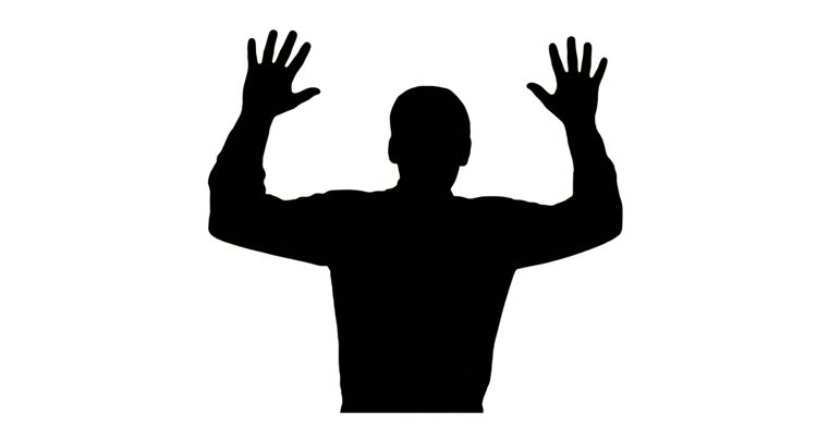 Silhouette of a person with both arms raised
