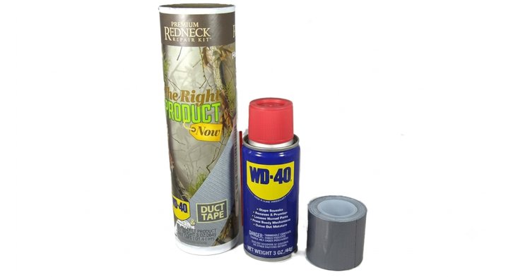 A cardboard box labeled Premium Redneck Repair Kit sits beside a can of WD-40 and a roll of duct tape